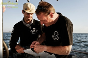On 9-1-10, I teamed up with Sea Shepherd for some water sampling in the Mississippi Sound, around Cat and Ship Island.  Additionally I was able to check out the beaches in Bay St. Louis and Long Beach Miss. and did take some water samples where that oh so familiar dispersant foam appeared.   Pictured here are  Sea Shepherd crewman David Hance and Brock Cahill carefully attaching the absorbant materials to the anchor.