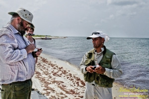 8/9/10 Horn Island, Lat  30,14.91N Long 88,42.0947W, Sampling with Boston Chemical Data, www.labs.pro , Pictured here is Strongbear  looking along beach for weathered tar ball samples from BP spill, north side of Horn Island.
